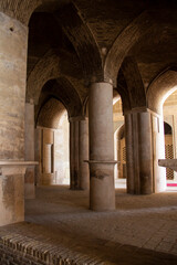 Fototapeta premium A very large interior with architectural columns with Islamic architecture known as Shabestan in Jame Atiq Mosque in Isfahan city (efahan), Iran