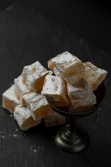 Eastern sweetness Turkish delight on a black background