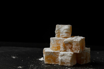 Eastern sweetness Turkish delight on a black background