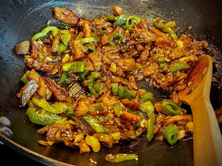 Vegan seitan and veggie stir fry- wok cooking.