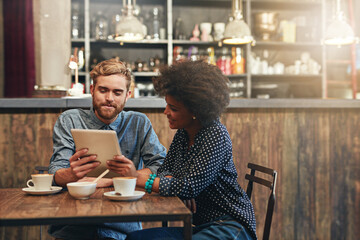 Couple, tablet and laughing or smile in coffee shop with social media meme, bonding and funny online information. Interracial, people and happy in cafe with tech for comic post update or mockup space