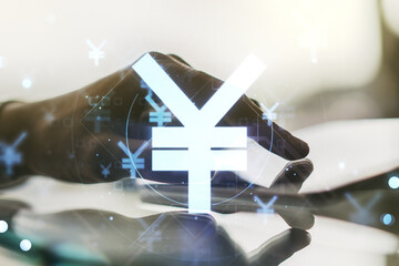 Creative Japanese Yen symbol sketch and hand working with a digital tablet on background, strategy...