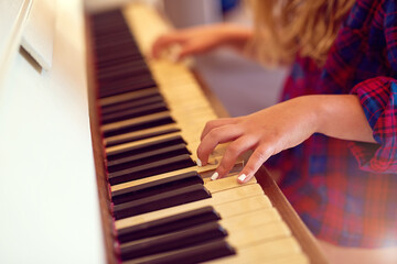 Piano, hands and keys for music with woman playing, artist and talent for concert. Fingers, jazz...