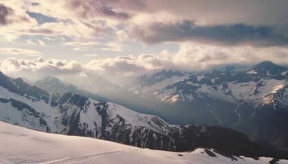panoramic view of the scenic landscape of snowy mountains and dramatic clouds