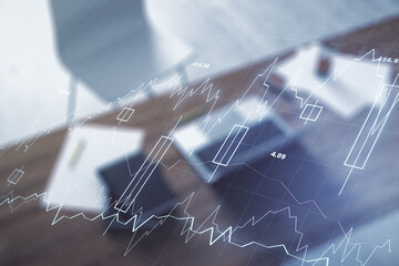 Double exposure of abstract creative financial diagram and modern desk with computer on background, banking and accounting concept