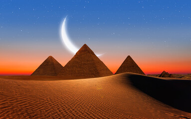 Giza Pyramid Complex with crescent moon at night - Cairo, Egypt