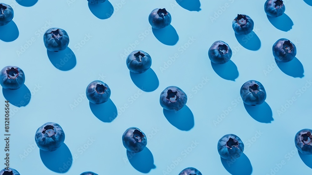 Poster fresh berries blueberry on blue background colorful fruit pattern of blueberries as background creat