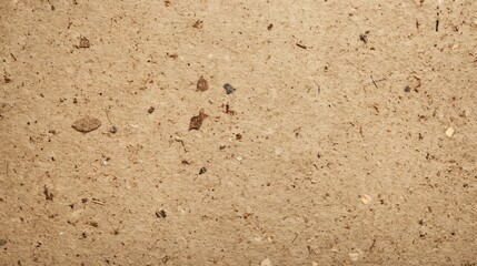 A close up view of a brown recycled paper with uneven surface and a slightly dirty paper texture