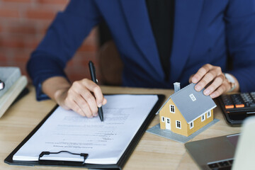 Real estate agent broker with loan or insurance contract documents..