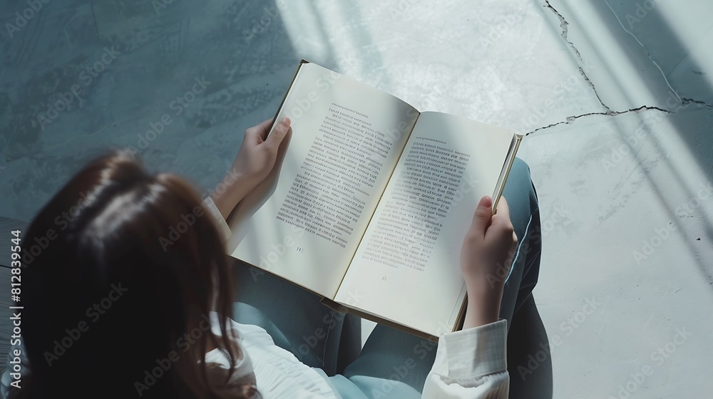 Poster top view of a woman reading an open book or magazine empty page mock up : Generative AI