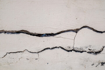 Cracked concrete wall broken wall at the outside cement corner that effected with earthquake and...