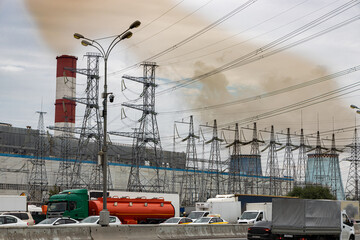 Power plant, pylons and chimneys emitting greenhouse gases; cooling tower and chimney emissions...