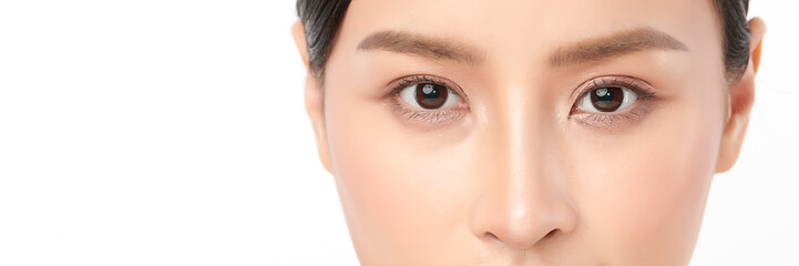 Close-up shot of beautiful Asian woman eyes on white background.