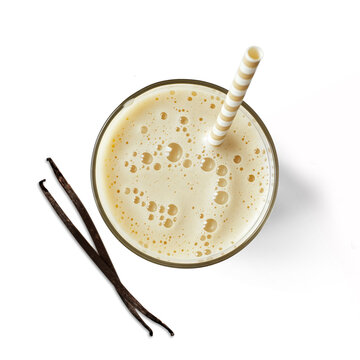 Glass of vanilla milkshake isolated on white background from top view
