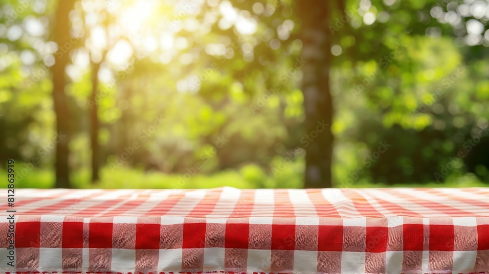 Aufkleber food background picnic table with tablecloth for food product display over blur green nature outdoor