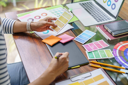 Teamwork brainstorming Creative idea Business project. Business People meeting taking notes while discussing with Color swatch samples to share idea