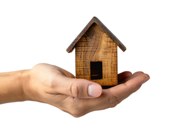 Hand holding a small simple house on isolated transparent background
