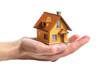 Hand holding a small simple house on isolated transparent background