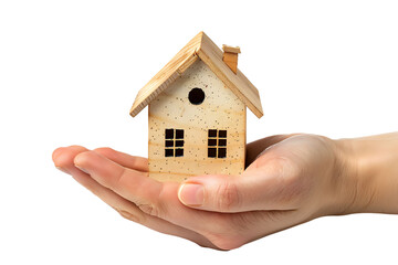 Hand holding a small simple house on isolated transparent background