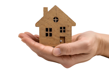 Hand holding a small simple house on isolated transparent background