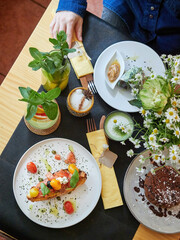 Healthy and nutritious food with refreshing drinks ready to enjoy at the cafeteria table. Maintaining a healthy and balanced diet. High angle view.