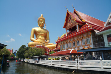 Big Golden Buddha Statue in Wat Pak Nam Phasi Charoen or Pak Nam Temple - It is famous for its...