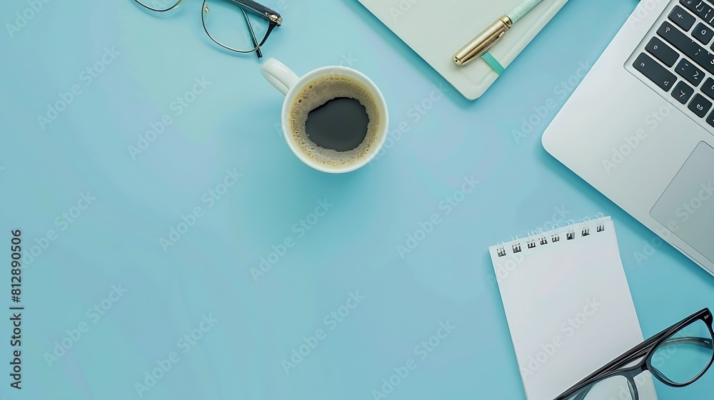 Leinwandbilder modern office desk table with laptop keyboard cup of coffee paper notebook pen glasses on blue backg