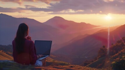 Young woman freelancer traveler working online using laptop and enjoying the beautiful nature landscape with mountain view at sunrise : Generative AI