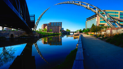 Sioux Falls Downtown River Greenway Trail, Skyline, Bridges, and Reflectoins on the Big Sioux River Water at Dusk in South Dakota, USA