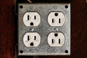 Old electrical wall outlet close-up