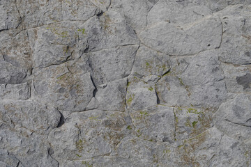 Stone texture worn by the wind and the sea of ​​the coast located on a wild beach.