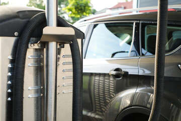 Cleaning the car interior with a vacuum cleaner at a car wash (part of the &ldquo;at the car wash&rdquo; series)