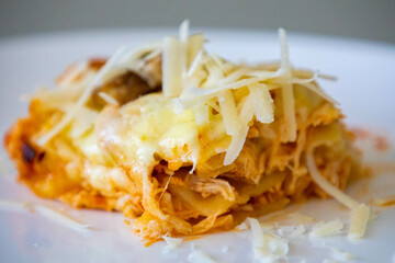 Traditional chicken lasagna with cheese and mushrooms