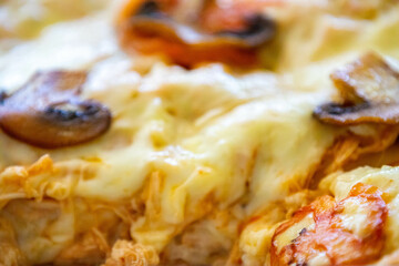 Traditional chicken lasagna with cheese and mushrooms