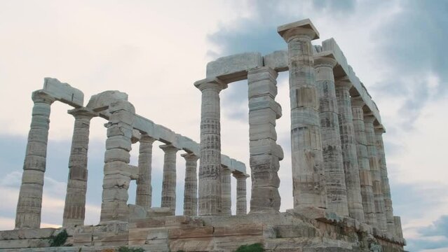 Temple of Poseidon on Cape Sounion at sunset, Attica, Greece. Ancient Greek architecture. Ruins of ancient temple of Greek god of the sea. Popular travel and touristic destination