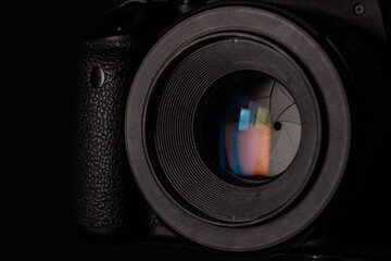 Close-up optical close-up black DSLR camera with closed iris diaphragm blades cine lens
