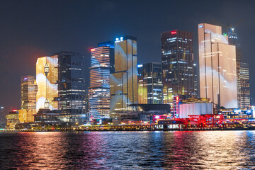 Naklejka premium Guangzhou, 13 April 2024: Canton skyline cityscape with skyscrapers in downtown at night in Guangzhou, China