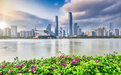 Naklejka premium Guangzhou, 13 April 2024: Canton skyline cityscape with skyscrapers in downtown at night in Guangzhou, China