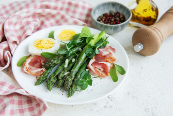 Fresh Asparagus and Prosciutto Salad Served With Boiled Eggs and Microgreens