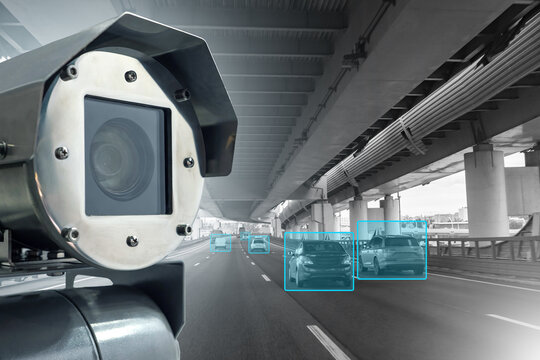 Road surveillance camera. CCTV for monitoring compliance with regulations. AI Camera near road. Video surveillance system records passing cars. Metal camera for detecting speed violations on road