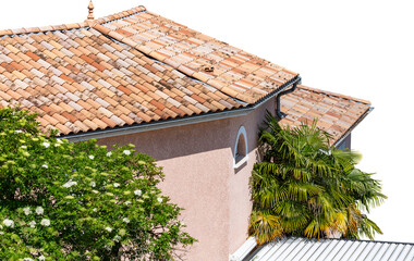 Typical Romanesque roof tiles, France. House, covered with the typical Roman tiles in various earth tones. Tiled house roof, isolated, PNG cutout. © Pi-R