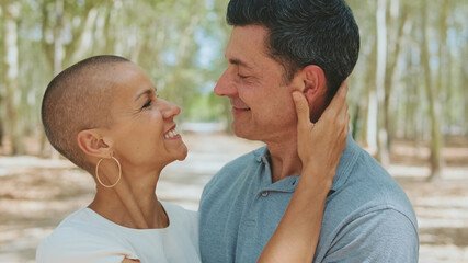 Fototapeta premium Close-up of happy married couple standing hugging each other