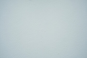 A white wall with a grey background. The wall is very plain and has no decoration
