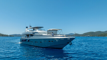 01.02.2024 Oludeniz - Turkey: Aerial drone photo of beautiful yacht at deep blue Aegean sea near island