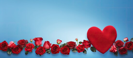 A vibrant arrangement of red roses is showcased on a captivating blue backdrop adorned with charming hearts offering ample room for additional text