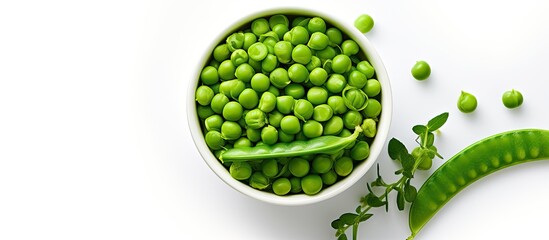 Top view of fresh organic raw green peas in a bowl surrounded by pea pods and plant leaves This healthy vegan and vegetarian legume food is rich in bean protein making it an excellent choice for raw