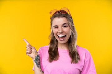 Happy emotions concept. Positive and beautiful young woman in studio in glasses