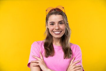 Happy emotions concept. Positive and beautiful young woman in studio in glasses