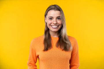 Happy emotions concept. Positive and beautiful young woman with smile in studio