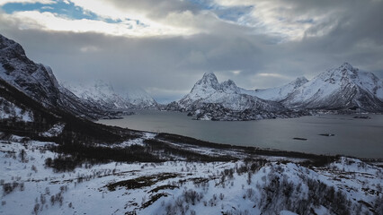 Dramatic landscape view of snowcapped mountains on the island of Hinnøya, part of the Lofoten...